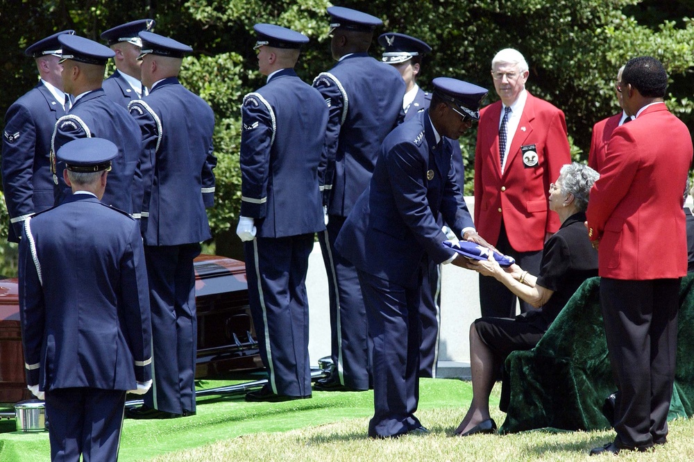 Gen. Lyles Presents Flag to Gen. Davis' Sister at Arlington Funeral