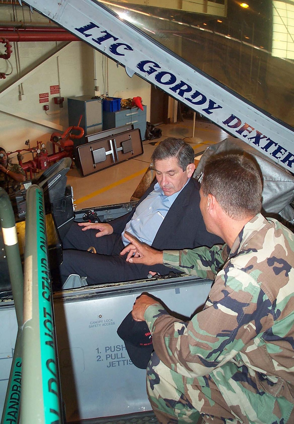 Air Force Officer Explains F-16 Cockpit to Deputy Defense Secretary