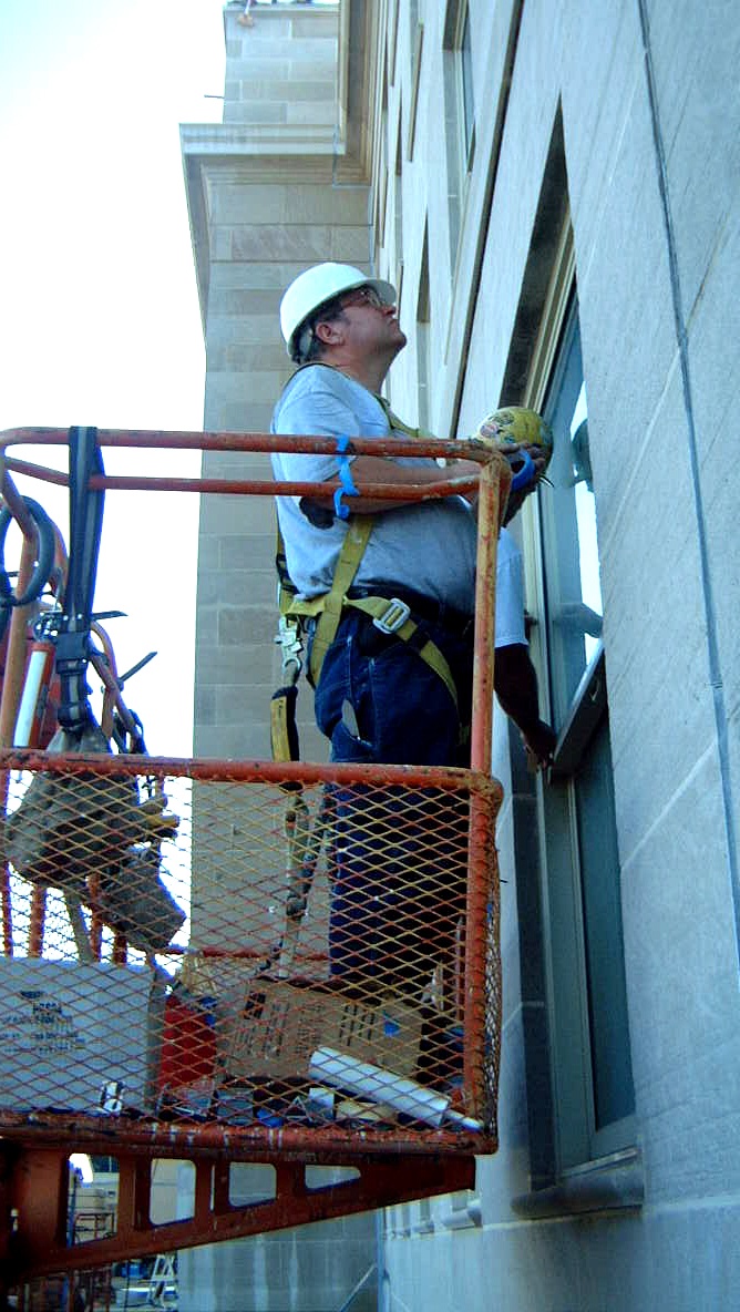 Ironworker Caulks Windows at the Pentagon