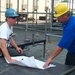 Workers Examine Blueprints for Pentagon 9/11 Ceremony Stage