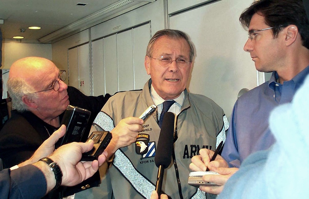 Rumsfeld Briefs Reporters Aboard Plane to NATO Meetings