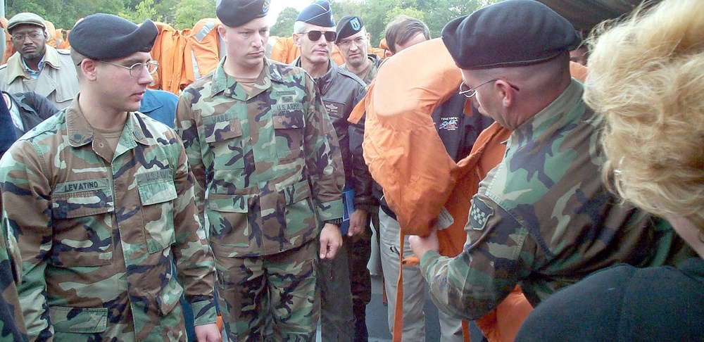 Army Sergeant Demonstrates Life Jacket Use Before High-Speed Vessel Cruise