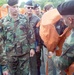 Army Sergeant Demonstrates Life Jacket Use Before High-Speed Vessel Cruise
