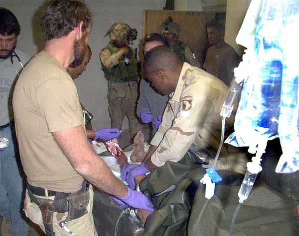 Special Forces Medic Treats Injured Afghan Soldier