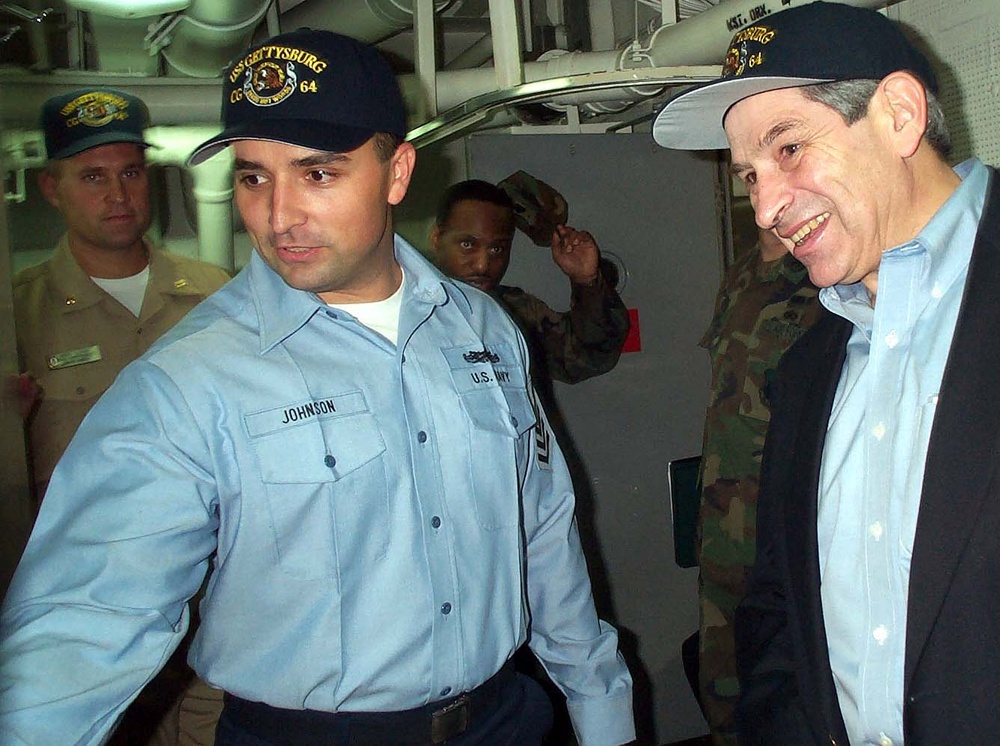 Navy Petty Officer Escorts Defense Official on Ship Tour