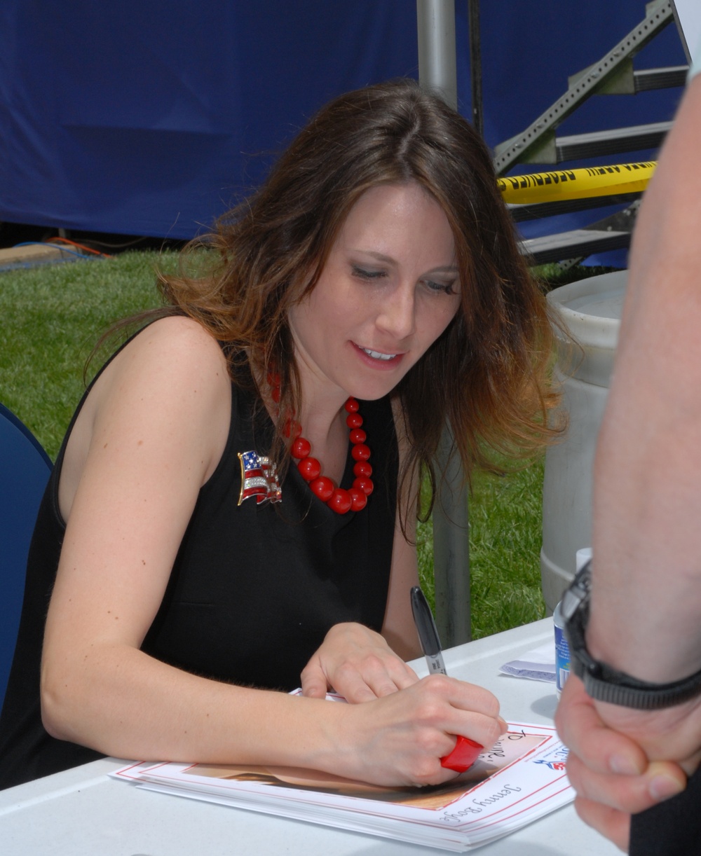 Entertainer Jenny Boyle Autographs Photo for Fan at Pentagon Ceremony
