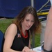 Entertainer Jenny Boyle Autographs Photo for Fan at Pentagon Ceremony