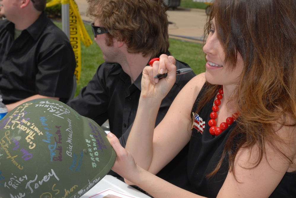 Entertainer Jenny Boyle Signs Helmet for Military Supporters at Pentagon Event