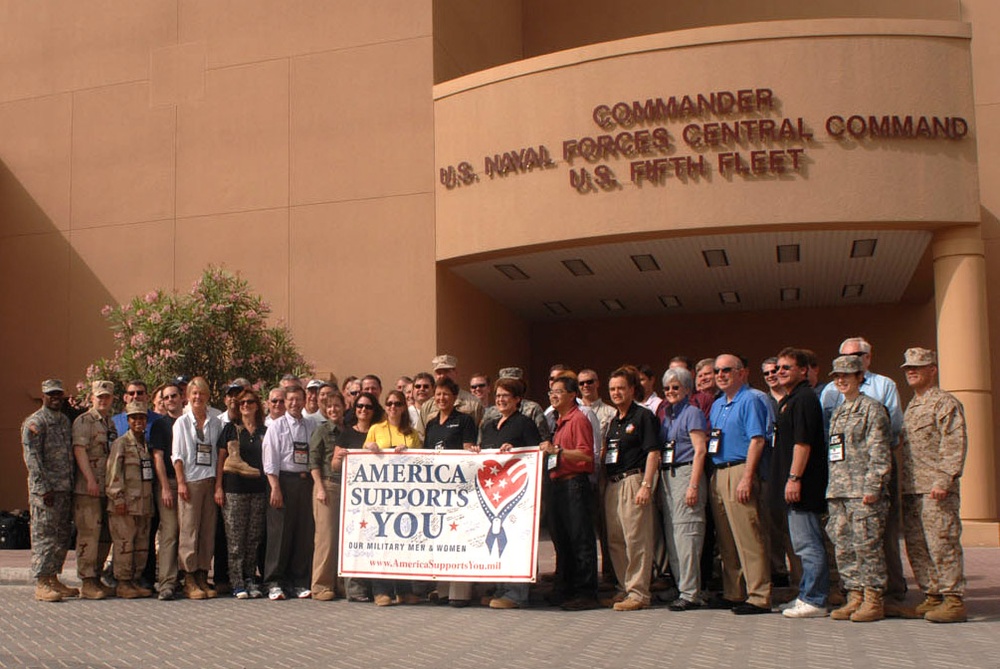 Joint Civilian Orientation Conference Participants Pose with America Supports You Banner in Bahrain