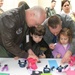 Air Force Colonel Helps Son Cut Shapes at Pentagon's Take Your Child to Work Day
