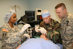 Army, Air Force Captains Practice Intubation at Medical Simulation Center