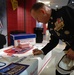 Marine Lt. Gen. Signs 'America Supports You' Banner at Circus Show