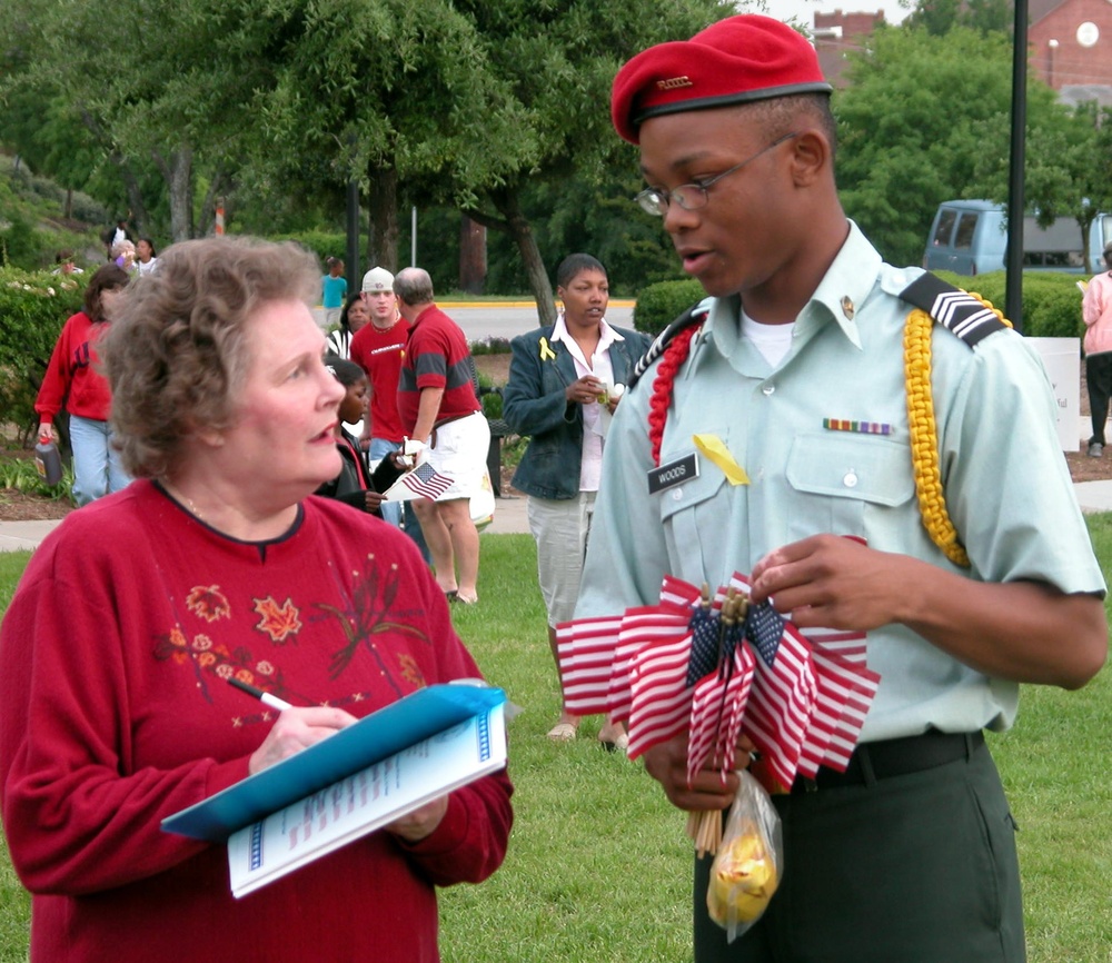 Junior ROTC Student Distributes Flags, Ribbons at America Supports You Rally