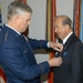 Air Force General Honors Retired Major General for Humanitarian Work