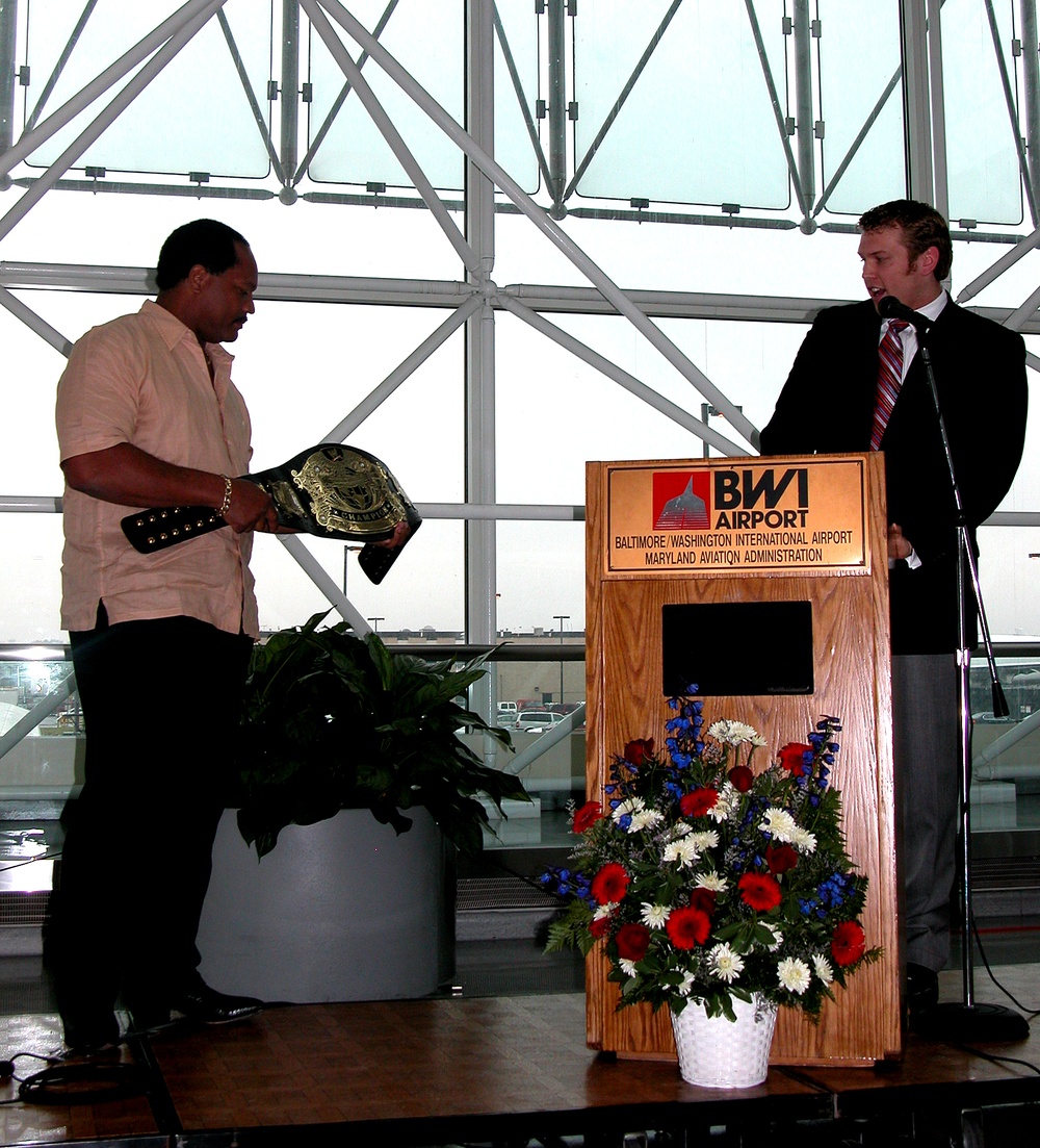 WWE Superstars Present Championship Belts to USO Gateway Lounge Sponsors
