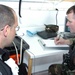 Army Medical Officer Examines Soldier After Sampling Exercise