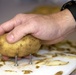 Soldier Peels Potatoes One-Handed for Troops with Disabilities