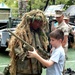 Marine Officer Lets Child Handle Sniper Rifle at Fleet Week Event