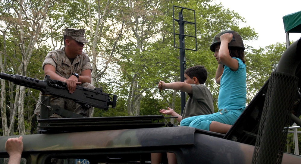 Young Siblings Fascinated by Marine Corps Humvee at Fleet Week Event