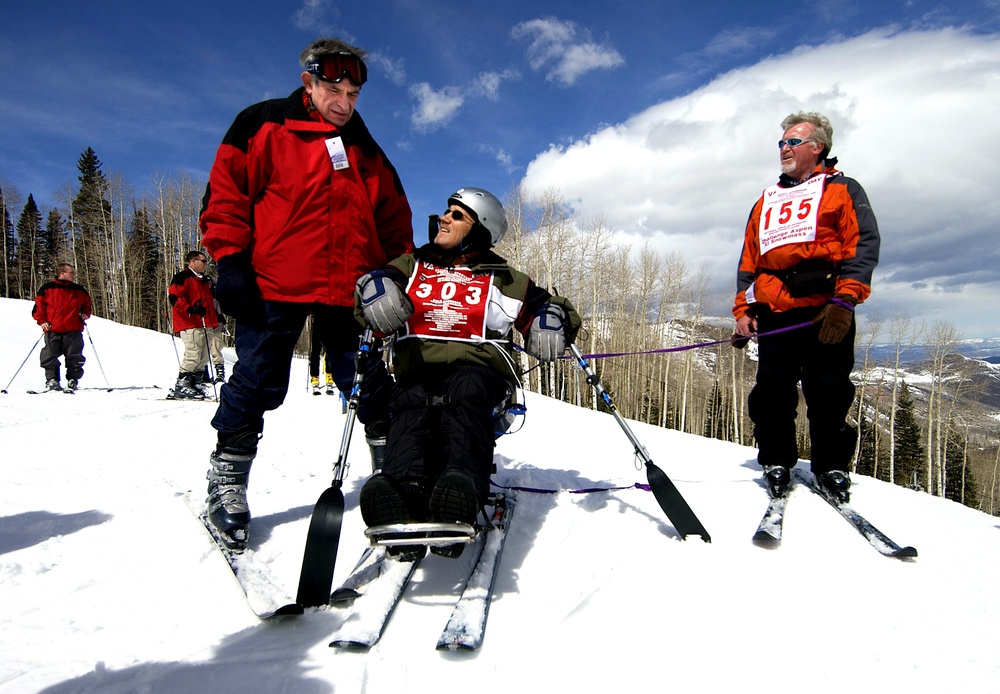 Defense Secretary Wolfowitz Assists Disabled Veteran on Adaptive Ski