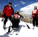 Defense Secretary Wolfowitz Assists Disabled Veteran on Adaptive Ski