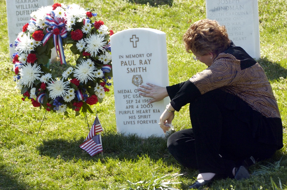 Widow Visits Husband's Grave at Arlington National Cemetery