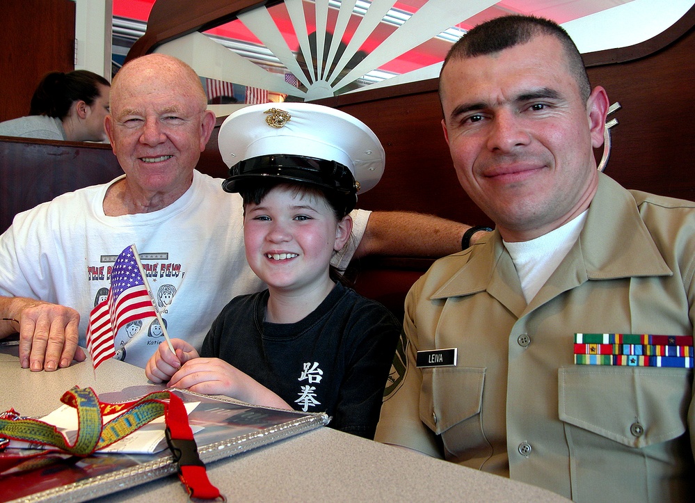 Young Girl and Veteran Grandfather Join Marine Recruiter for Letter Writing Campaign