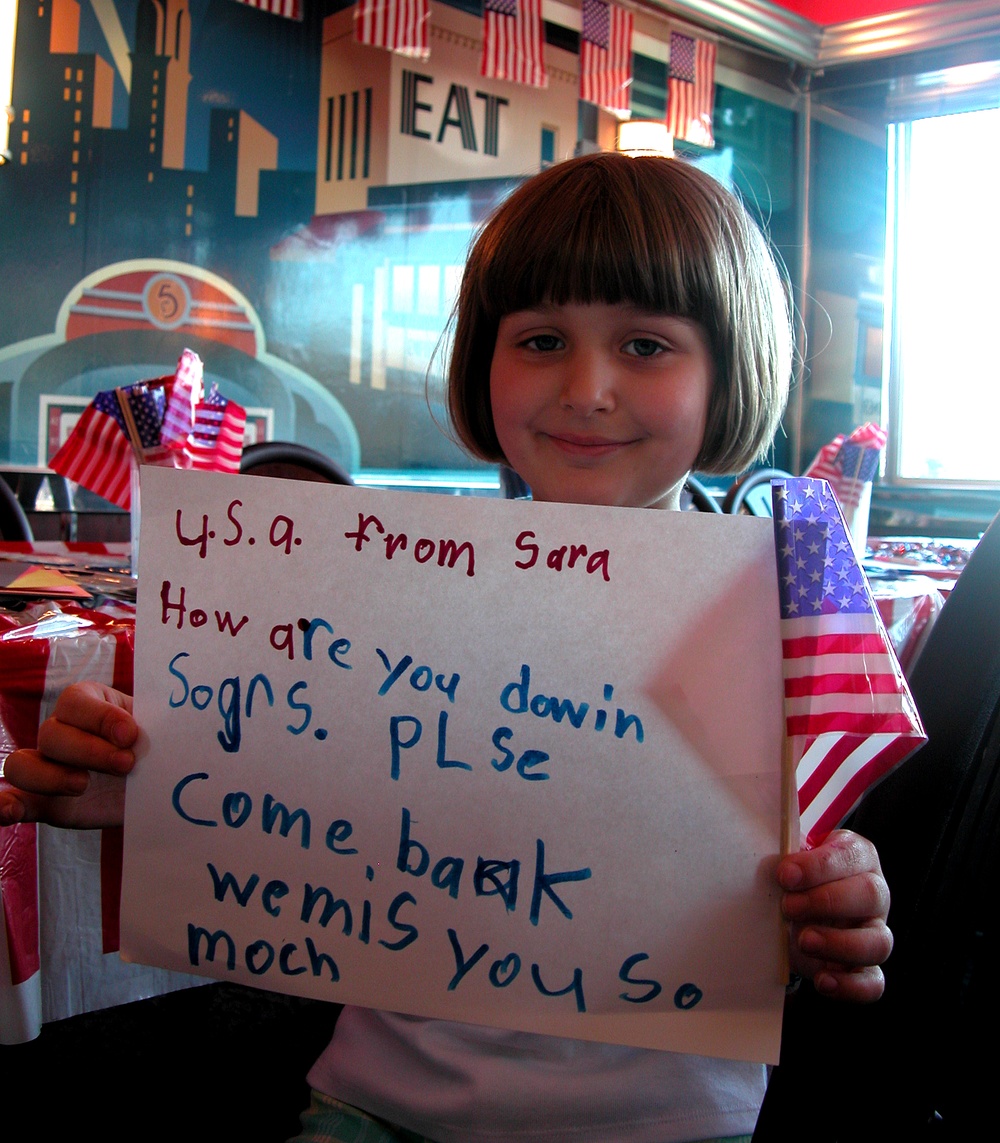 Young Girl Writes Letter to Troops at Silver Diner Campaign