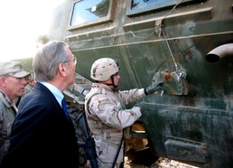 Rumsfeld Visits Troops, Inspects Damaged Armored Vehicle in Iraq