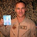 Air Force Lt. Col. Poses with Daughter's Drawing of Herself