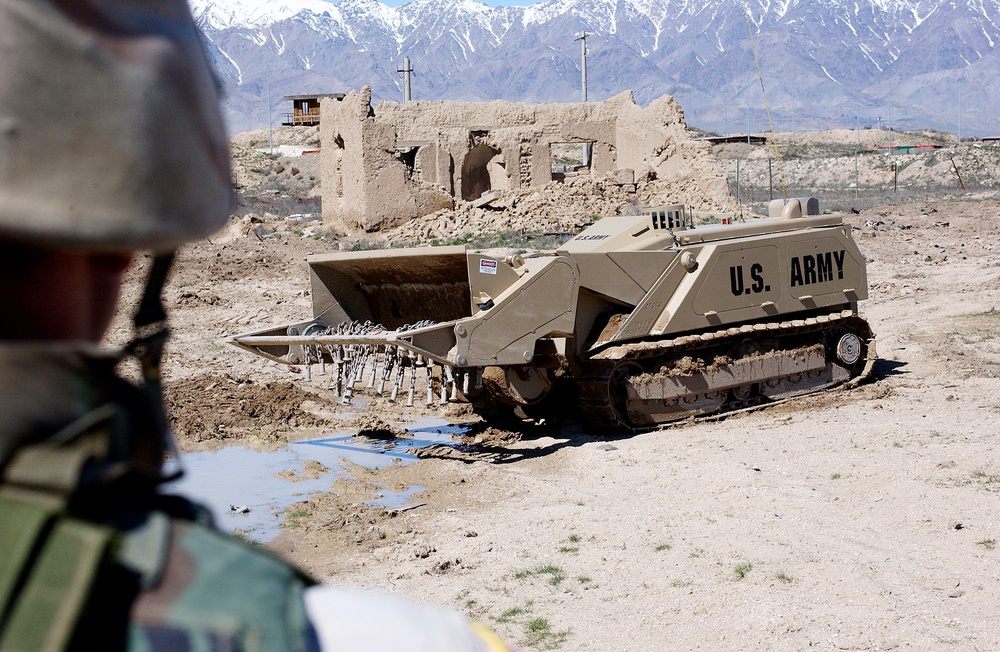 Army Engineer Operates Remote-Controlled Mine Clearing Device