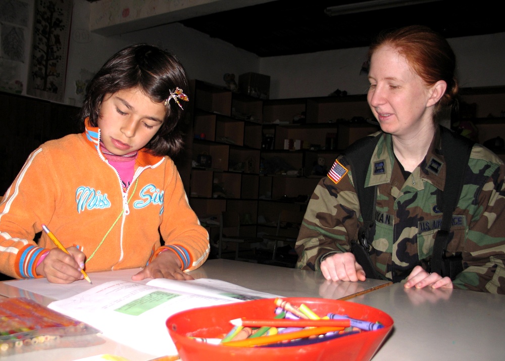 Air Force Officer Connects with Kosovar Girl at Pristina Center