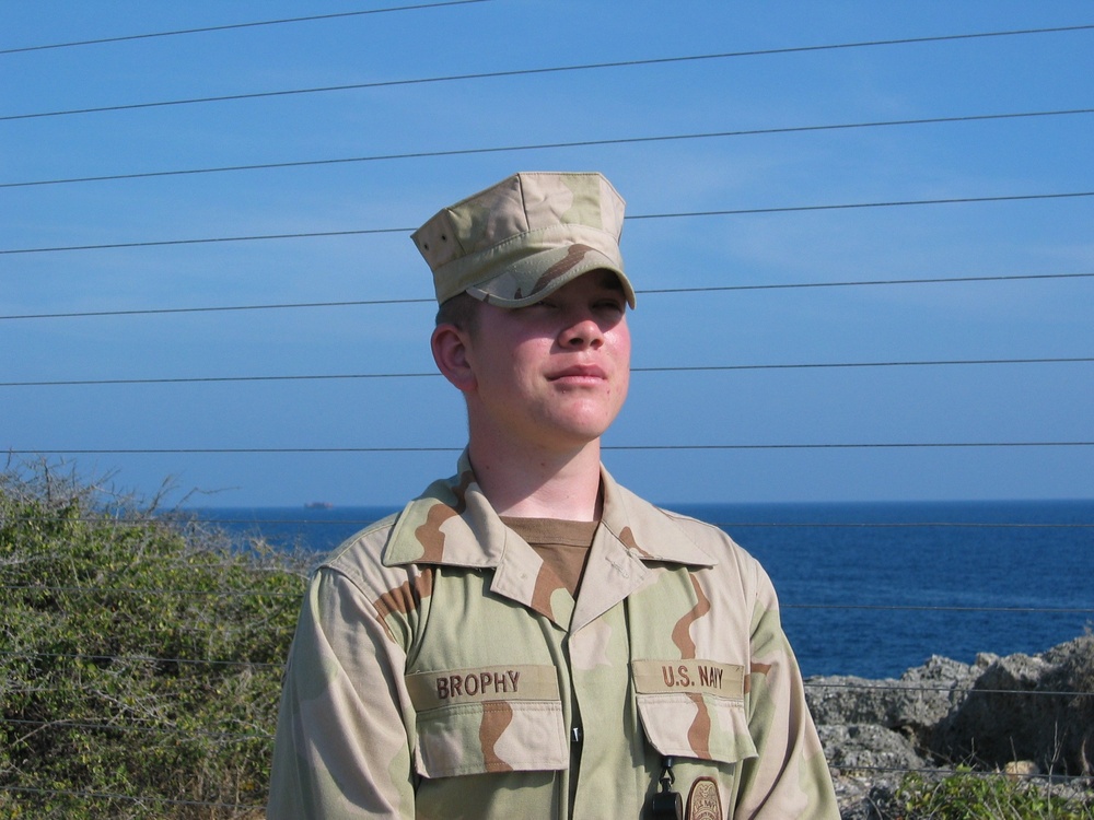 Navy Seaman Guarded by Electrified Fence at Guantanamo Bay