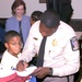 Police Chief Autographs Program for Student at MLK Breakfast