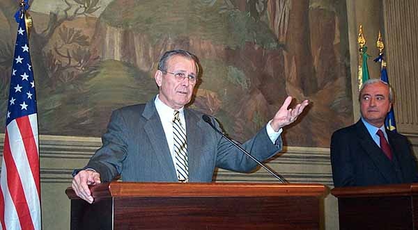 Rumsfeld Gestures During Meeting with Italian Counterpart in Rome