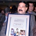 Iraqi Man Holds Poster Honoring Family Killed in 1991 Uprisings