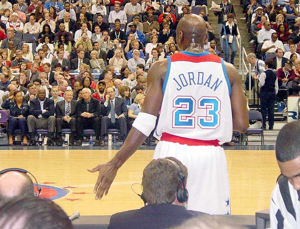 Jordan Receives Flag from Rumsfeld in Final Home Game