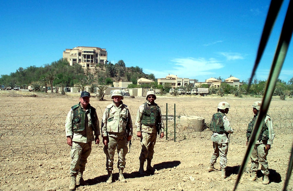 U.S. Troops Stand Amid Saddam Hussein's Lavish Palace