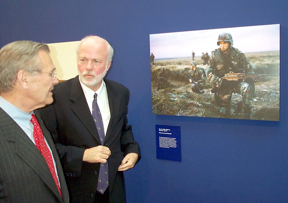 Kennerly Escorts Rumsfeld Through Military Photography Exhibit