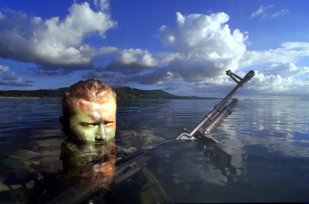 Navy SEAL Partially Camouflaged in Water at Andersen Air Force Base, Guam