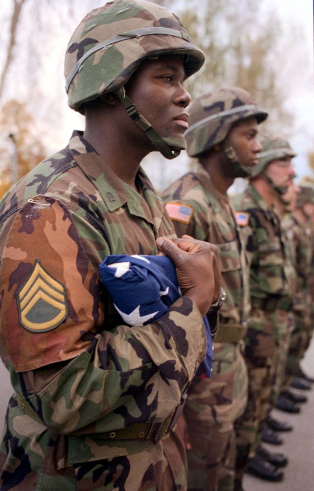 Army Spc. Carlos Melvin Holds Lowered American Flag After Training in Germany