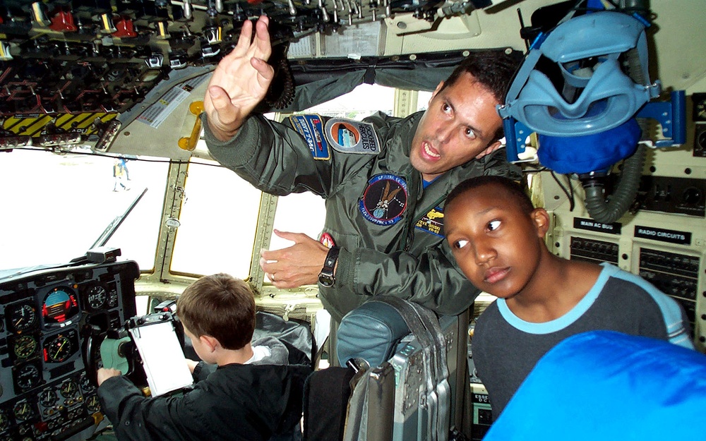 Young Visitors Explore C-130 Cockpit at Joint Service Open House