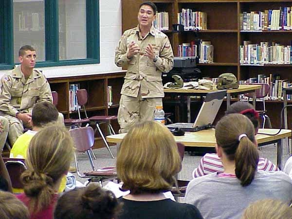 Soldier Explains Protective Vest Requirements in Hostile Environment
