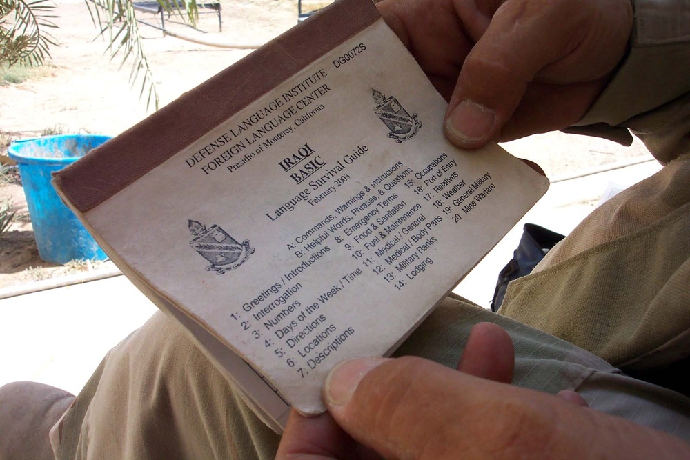 Army Command Sgt. Maj. Uses Language Guide to Communicate with Iraqis
