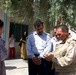 Army NCO Uses Language Guide to Assist Iraqi Officials