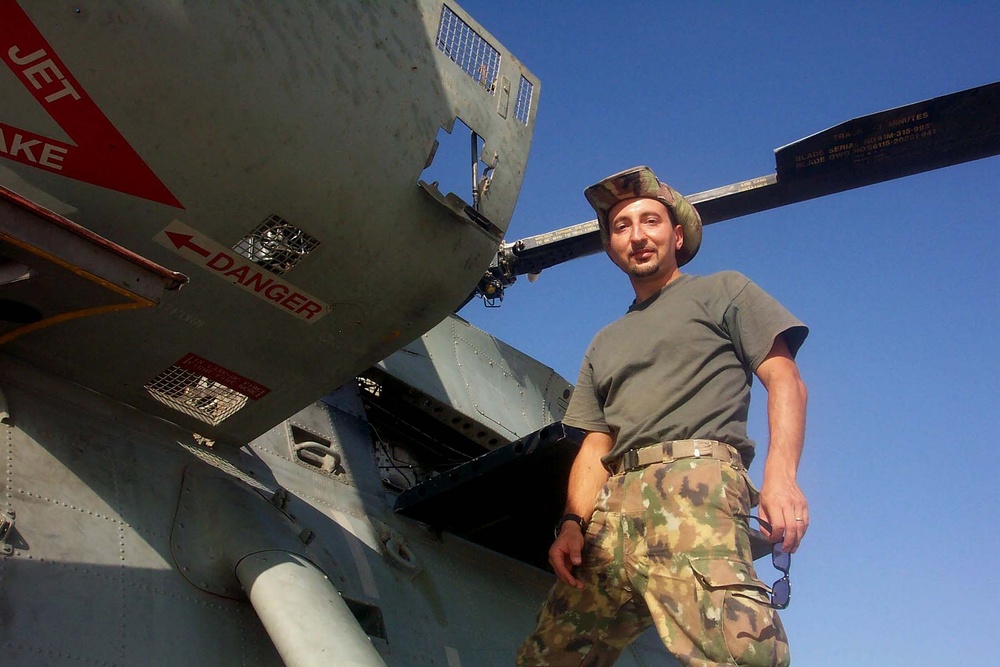 Italian Airman Guards Helicopter at Tallil Air Base in Iraq Italian Airman Guards Helicopter at Tallil Air Base in Iraq