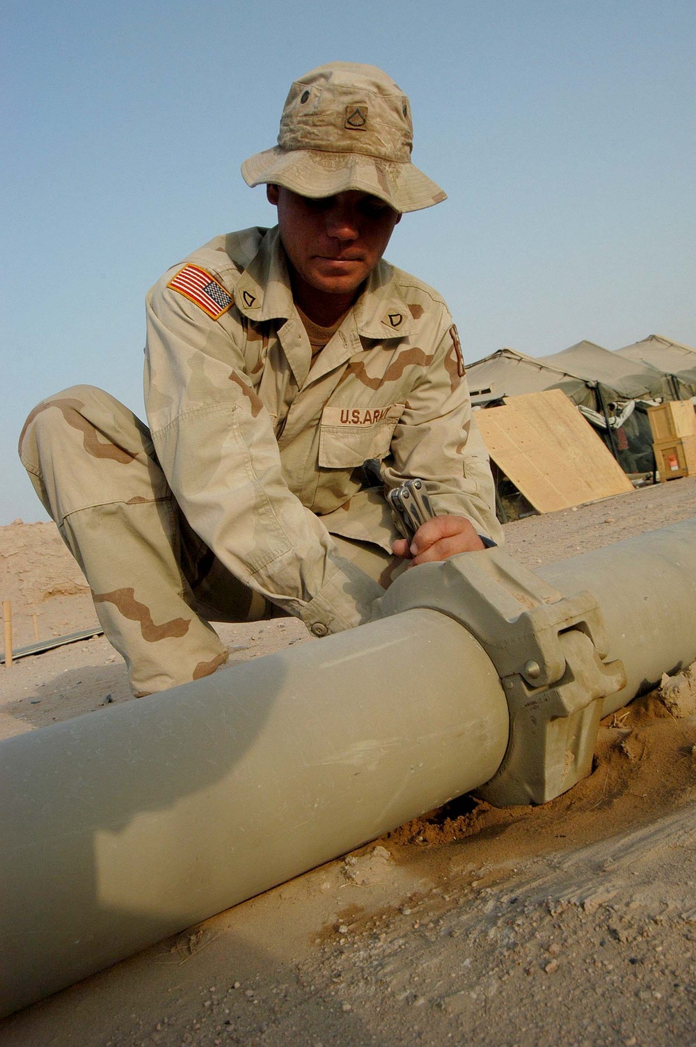 Army Fuel Specialist Inspects Pipeline at Camp Udairi