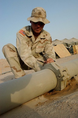 Army Fuel Specialist Inspects Pipeline at Camp Udairi
