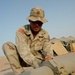 Army Fuel Specialist Inspects Pipeline at Camp Udairi