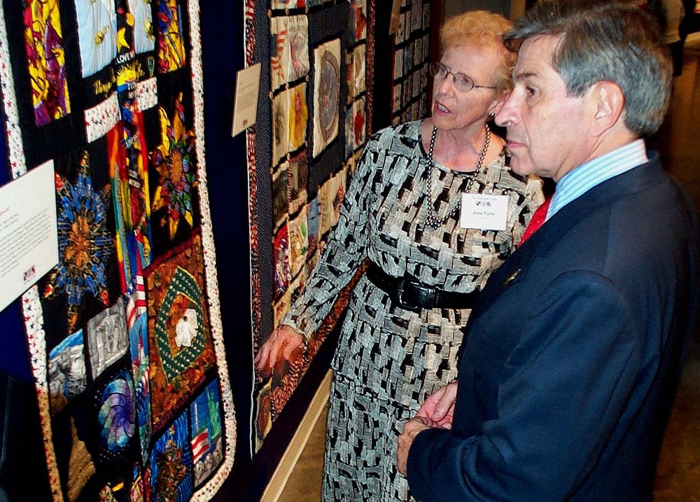 Wolfowitz, Curator Examine 9/11 Memorial Quilts at Arlington